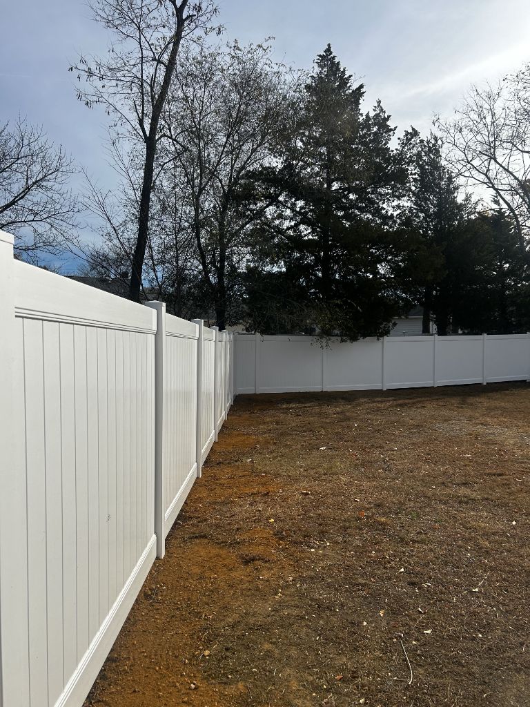 White vinyl privacy fence — full yard installation