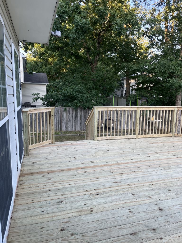New pressure treated wood deck with natural railing