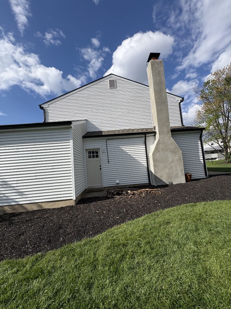 Clean white vinyl siding on two-story home