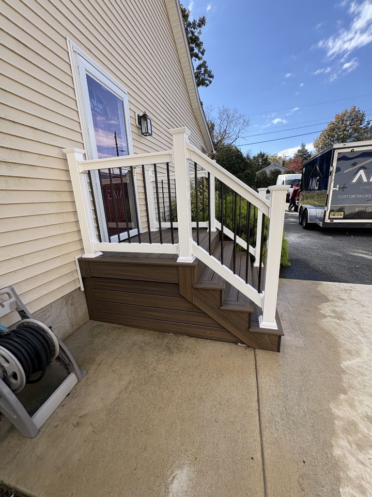 Small composite landing deck with AMG Contractors trailer in background