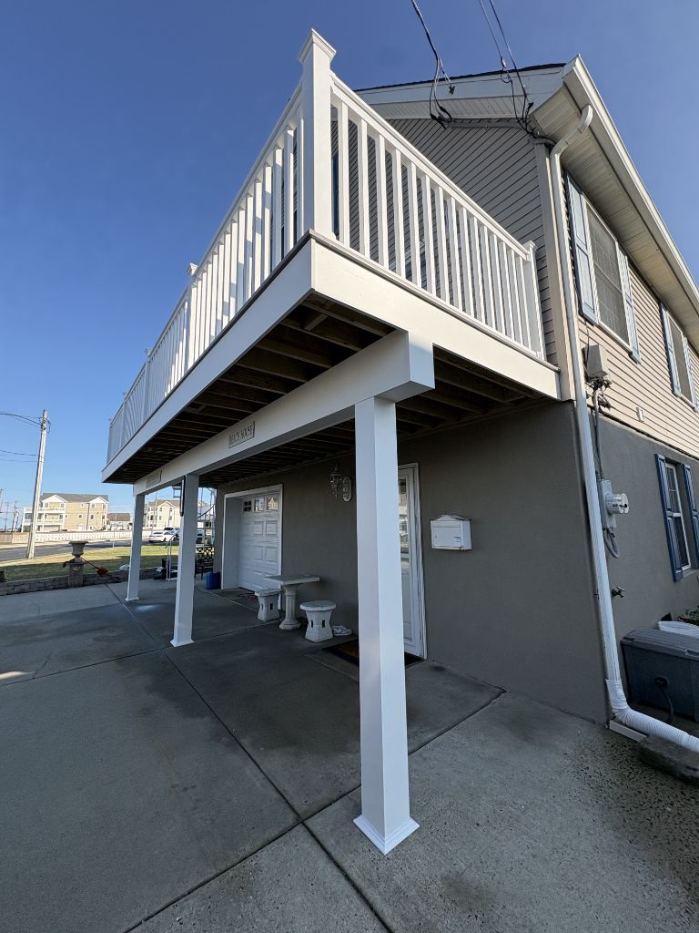 Elevated deck with white railing on South Jersey home