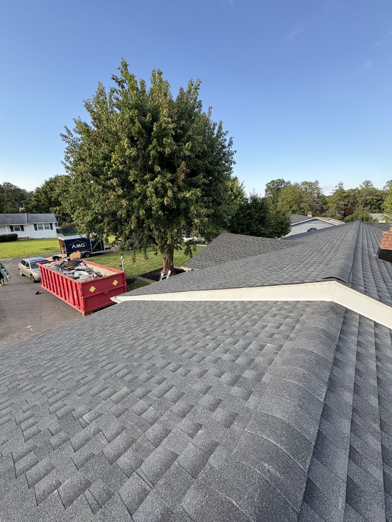 Completed asphalt shingle roof replacement by AMG Contractors