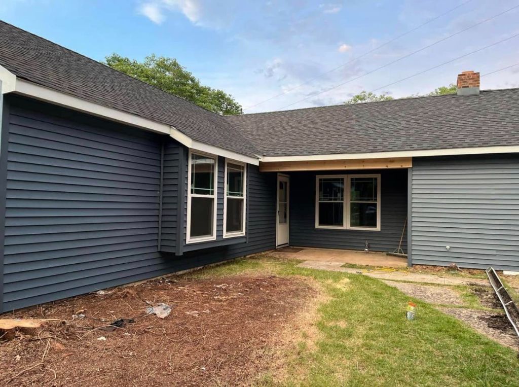 New dark navy vinyl siding installed on South Jersey home
